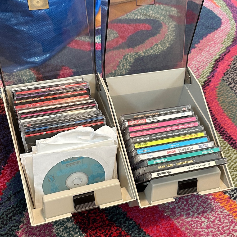 90s and 00s Video Games and CDs with Storage Boxes